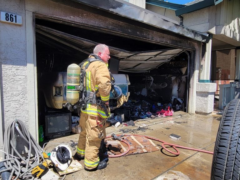 Fireman in front of a garage